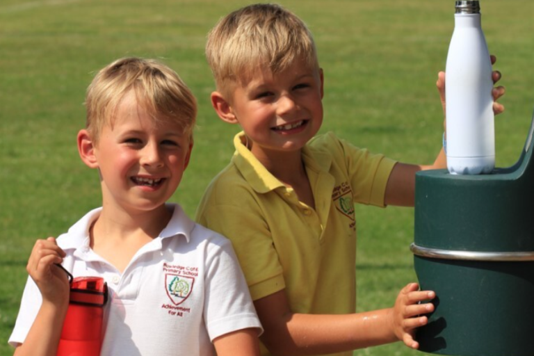 Children at bottle refill station in Binsted